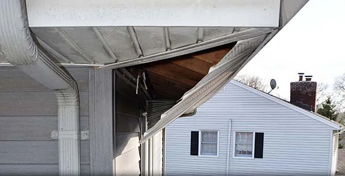 Torn soffit before repair